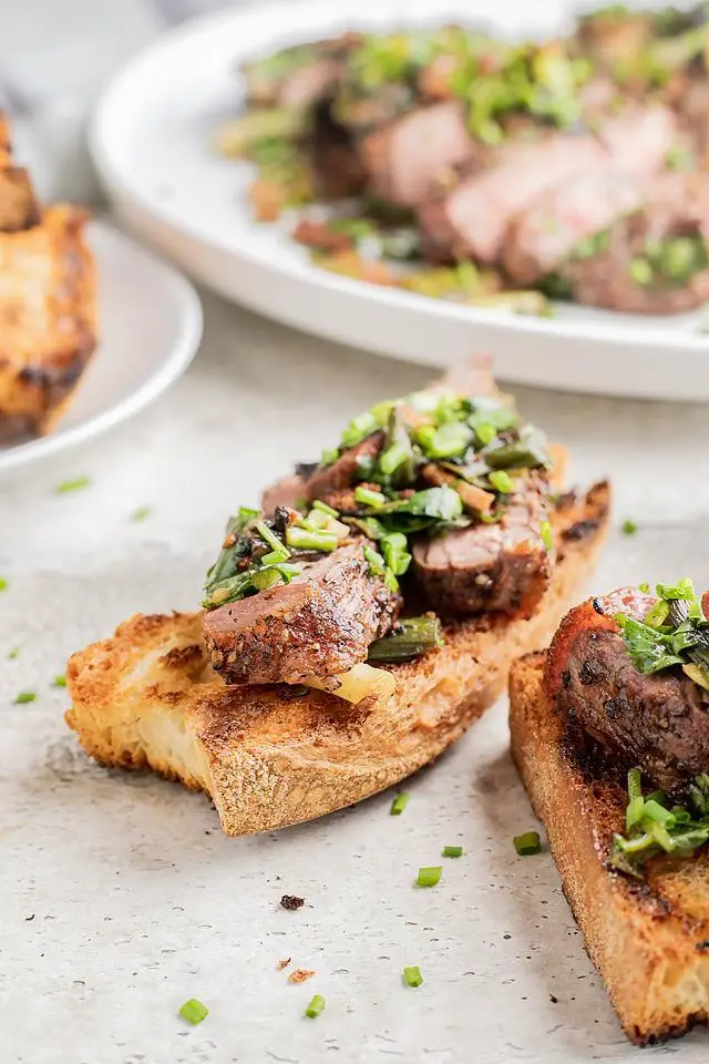 Grilled Steak with Herbed Scallion Topping